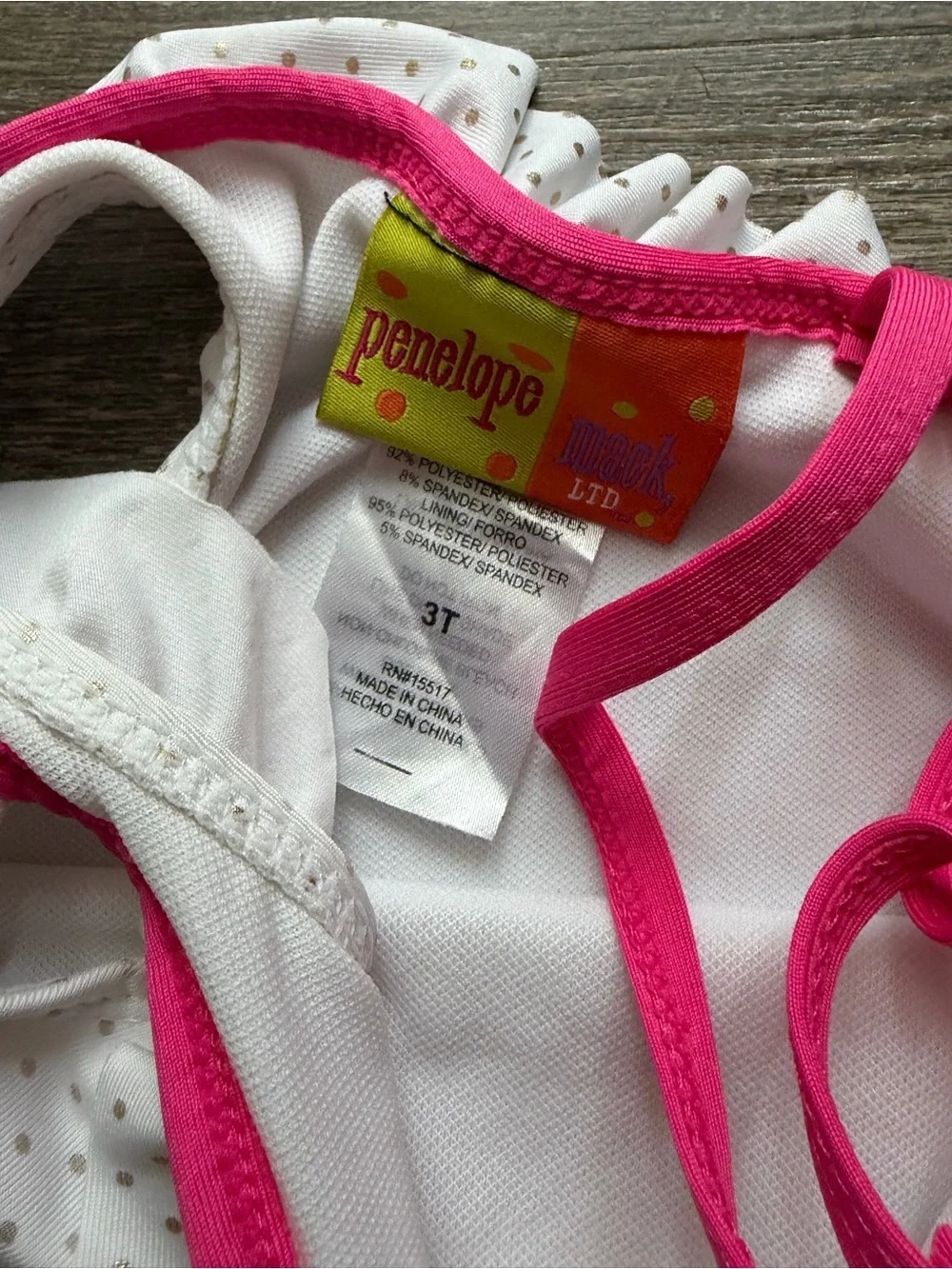 Penelope Mack White Swimsuit with Pink Trim & Flower
